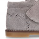 Suede Leather kids booties with chopped design and laceless.