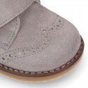 Suede Leather kids booties with chopped design and laceless.