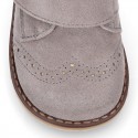 Suede Leather kids booties with chopped design and laceless.