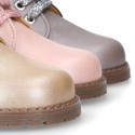 Girl safari boots with ties closure and fake hair neck in PEARL leather.