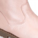 Girl boots with zipper closure and fake hair neck in PEARL effect leather.