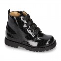 ROCK style BLACK patent finish girl boots with metal ties closure.