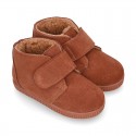 TAN color Suede leather little bootie sneaker style with fake hair lining and laceless.