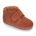 TAN color Suede leather little bootie sneaker style with fake hair lining and laceless.