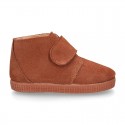 TAN color Suede leather little bootie sneaker style with fake hair lining and laceless.