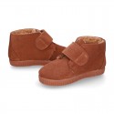 TAN color Suede leather little bootie sneaker style with fake hair lining and laceless.