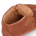 TAN color Suede leather little bootie sneaker style with fake hair lining and laceless.