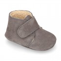 Suede leather Baby safari boots laceless and with wool knit lining.