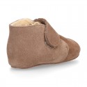 Suede leather Baby safari boots laceless and with wool knit lining.