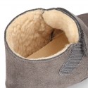 Suede leather Baby safari boots laceless and with wool knit lining.