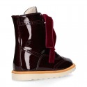 Girl boots PASCUALA style with velvet ties closure in METAL PATENT leather.