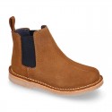 Kids ankle boots with elastic band in suede leather in TAN color.