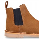 Kids ankle boots with elastic band in suede leather in TAN color.