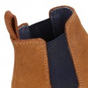 Kids ankle boots with elastic band in suede leather in TAN color.