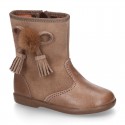 Classic kids suede leather boots with TASSELS and FAKE HAIR POMPONS design.