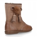 Classic kids suede leather boots with TASSELS and FAKE HAIR POMPONS design.