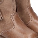Classic kids suede leather boots with TASSELS and FAKE HAIR POMPONS design.