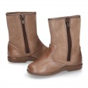 Classic kids suede leather boots with TASSELS and FAKE HAIR POMPONS design.