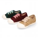 Suede leather Kids Sneaker or Bamba style shoes with toe cap and VICHY ties closure.