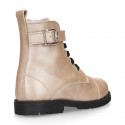 Rock style LAMINATED leather Girl boots with laces and zipper closure.