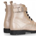 Rock style LAMINATED leather Girl boots with laces and zipper closure.