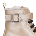 Rock style LAMINATED leather Girl boots with laces and zipper closure.