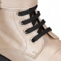 Rock style LAMINATED leather Girl boots with laces and zipper closure.