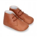 Nappa leather little bootie for babies with laces in TAN color.