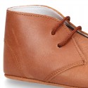 Nappa leather little bootie for babies with laces in TAN color.