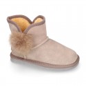 Suede leather Australian style Boot shoes with POMPOM design and fake hair lining.