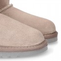 Suede leather Australian style Boot shoes with POMPOM design and fake hair lining.