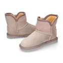 Suede leather Australian style Boot shoes with POMPOM design and fake hair lining.