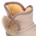 Suede leather Australian style Boot shoes with POMPOM design and fake hair lining.