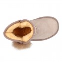 Suede leather Australian style Boot shoes with POMPOM design and fake hair lining.