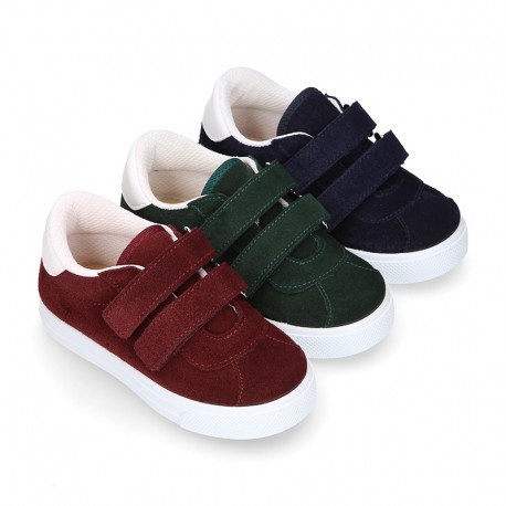 Suede leather OKAA Kids Sneaker or Tenis style shoes with double hook and loop strap closure.