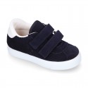 Suede leather OKAA Kids Sneaker or Tenis style shoes with double hook and loop strap closure.