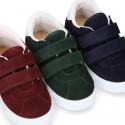 Suede leather OKAA Kids Sneaker or Tenis style shoes with double hook and loop strap closure.