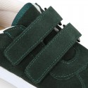 Suede leather OKAA Kids Sneaker or Tenis style shoes with double hook and loop strap closure.