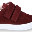 Suede leather OKAA Kids Sneaker or Tenis style shoes with double hook and loop strap closure.