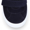 Suede leather OKAA Kids Sneaker or Tenis style shoes with double hook and loop strap closure.