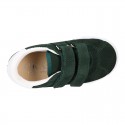 Suede leather OKAA Kids Sneaker or Tenis style shoes with double hook and loop strap closure.