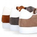 Suede leather OKAA Kids Sneaker or Tenis style shoes with double hook and loop strap closure in autumn colors.