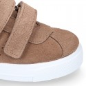 Suede leather OKAA Kids Sneaker or Tenis style shoes with double hook and loop strap closure in autumn colors.