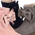 Suede leather Girl ankle boot shoes with fake hair lining and RIBBON design.