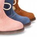 Little ankle boot shoes with FAKE HAIR lining and POMPOMS design in suede leather for first steps.