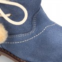 Little ankle boot shoes with FAKE HAIR lining and POMPOMS design in suede leather for first steps.