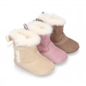 Baby girl bootie with BOW, hook and loop strap closure in suede leather.