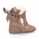 Baby girl bootie with BOW, hook and loop strap closure in suede leather.