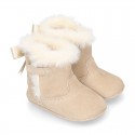 Baby girl bootie with BOW, hook and loop strap closure in suede leather.