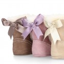 Baby girl bootie with BOW, hook and loop strap closure in suede leather.